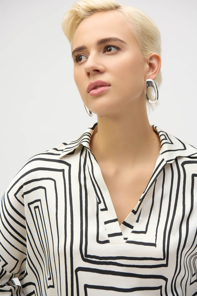 Close-up of V-neckline and shirt collar detail
