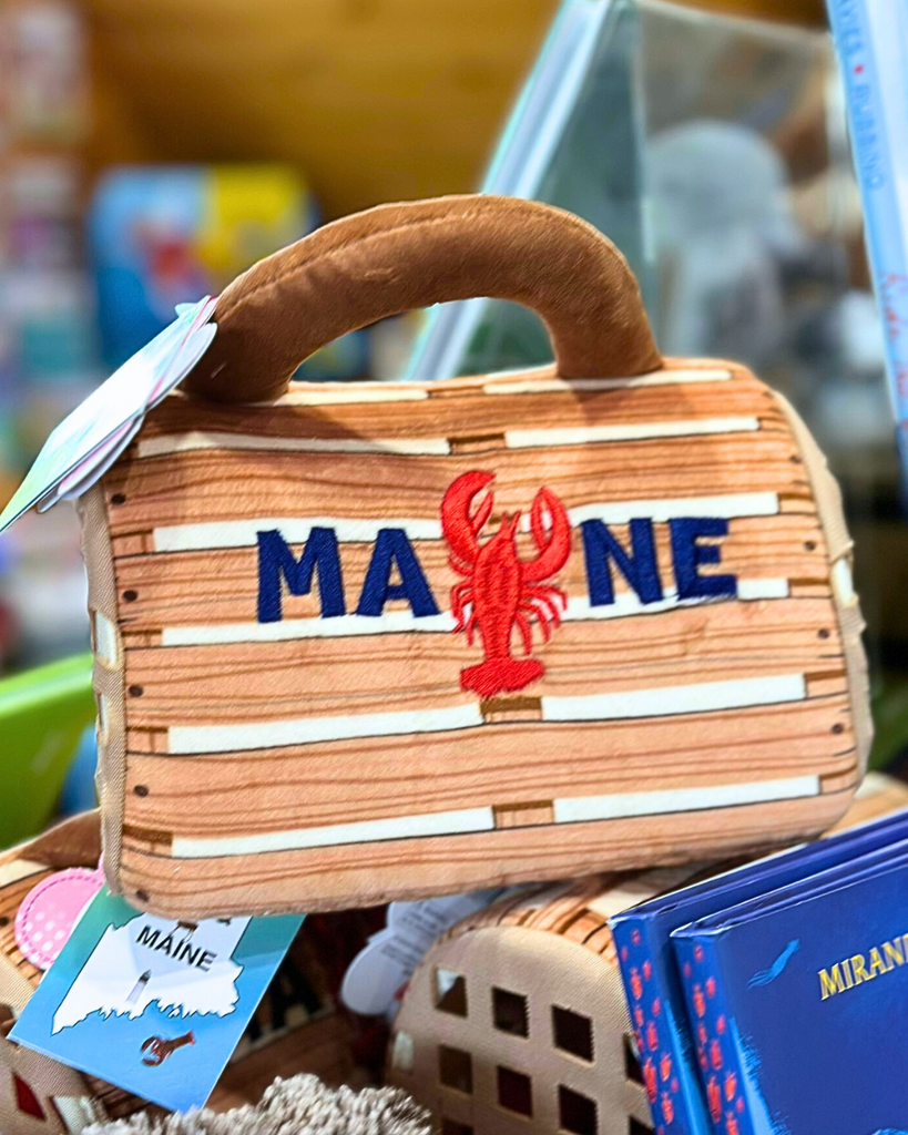 Mini plush lobster toy in Maine-branded crate purse