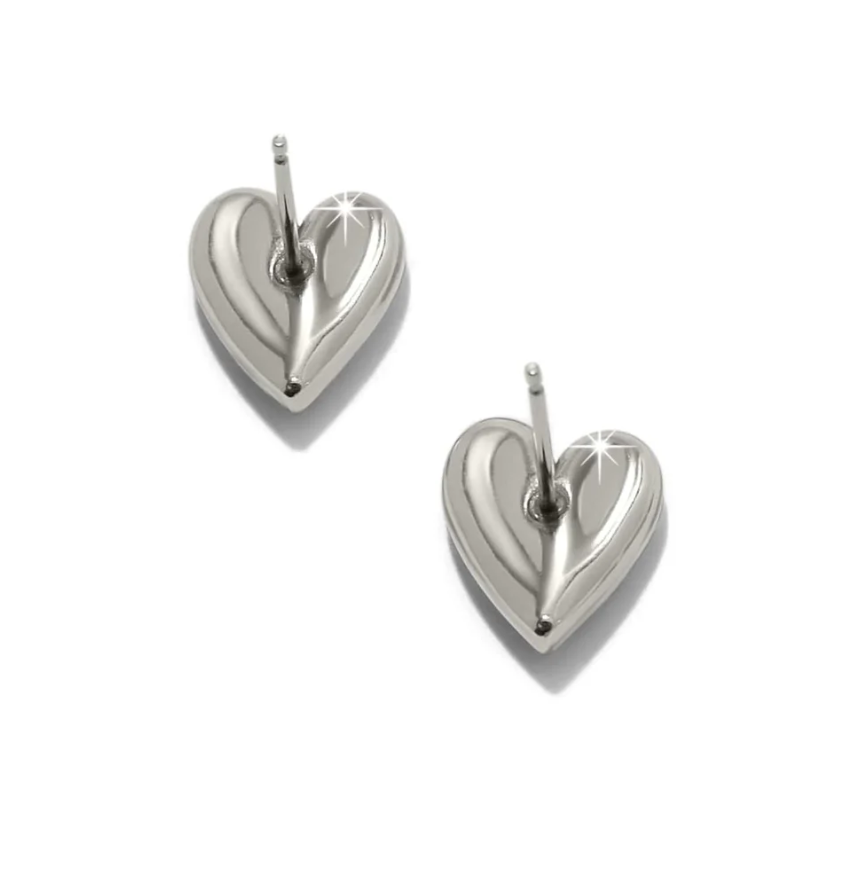 Sculptural heart earrings on white background