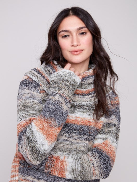 Close-up of cable knit texture and multicolor yarn
