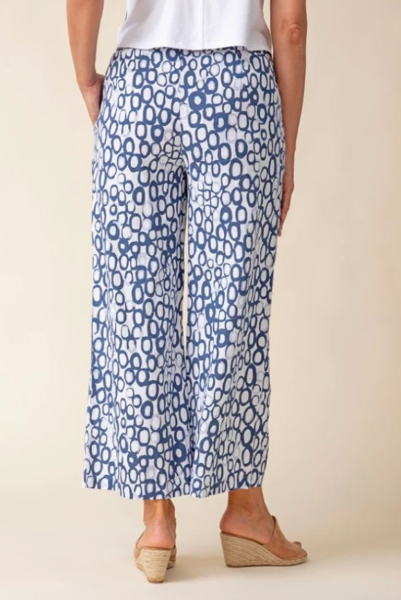 Woman wearing Habitat Clothing Inner Circle Veranda Pant in a breathable linen-cotton blend, styled with ankle length and on-seam pockets, featuring an exclusive print