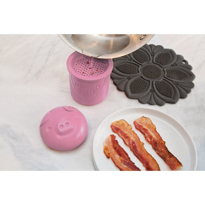 Bacon Bin in kitchen setting next to a pan of cooked bacon