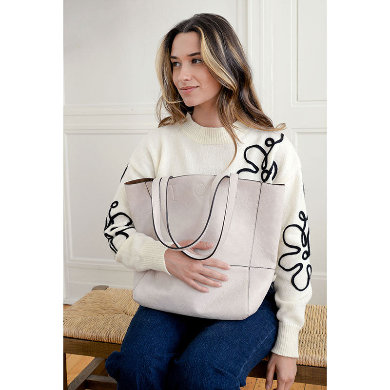 Faith Raw Edge Tote; soft vegan leather, raw edges & roomy design styled for spring—curated just for you by Daisy Jane’s.