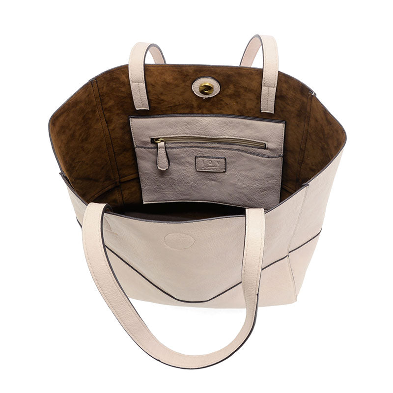 Faith Raw Edge Tote; soft vegan leather, raw edges & roomy design—curated just for you by Daisy Jane’s.