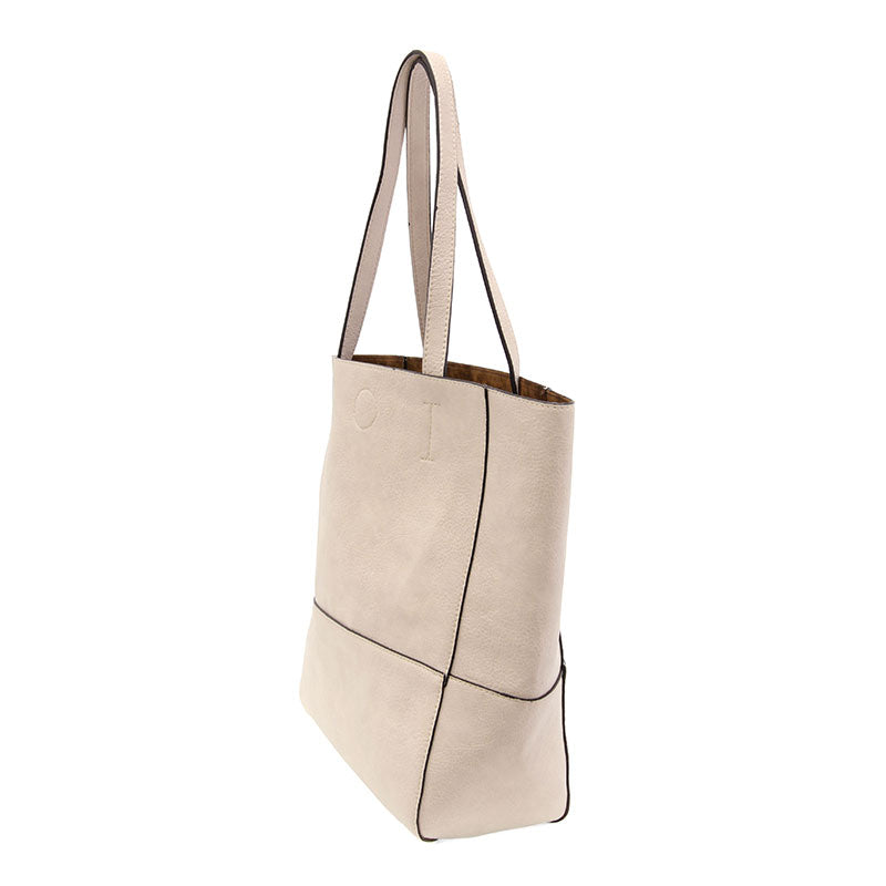 Faith Raw Edge Tote; soft vegan leather, raw edges & roomy design—curated just for you by Daisy Jane’s.