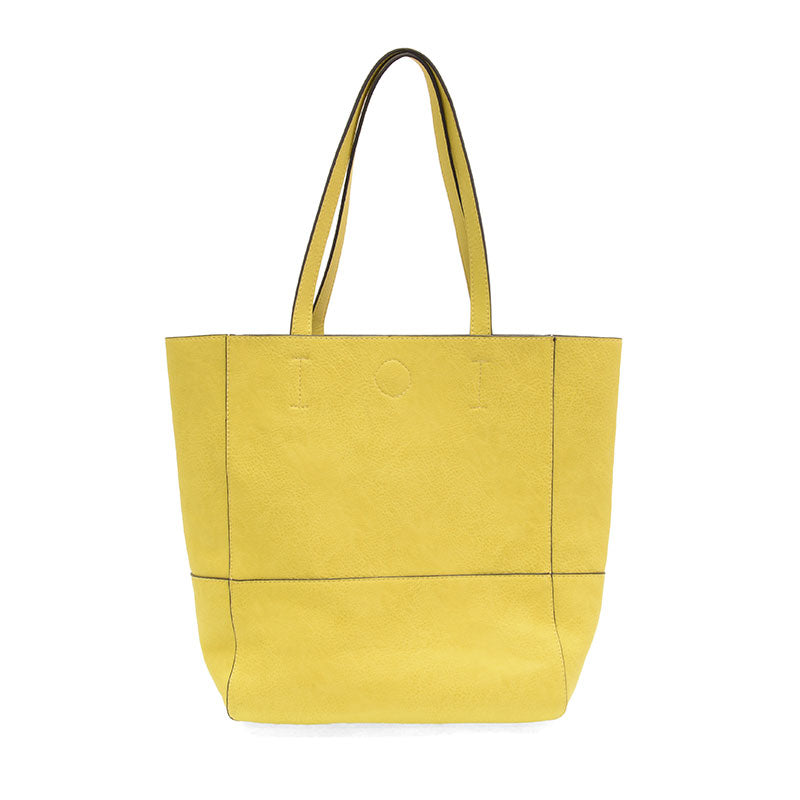 Yellow Faith Raw Edge Tote; soft vegan leather, raw edges & roomy design—curated just for you by Daisy Jane’s.