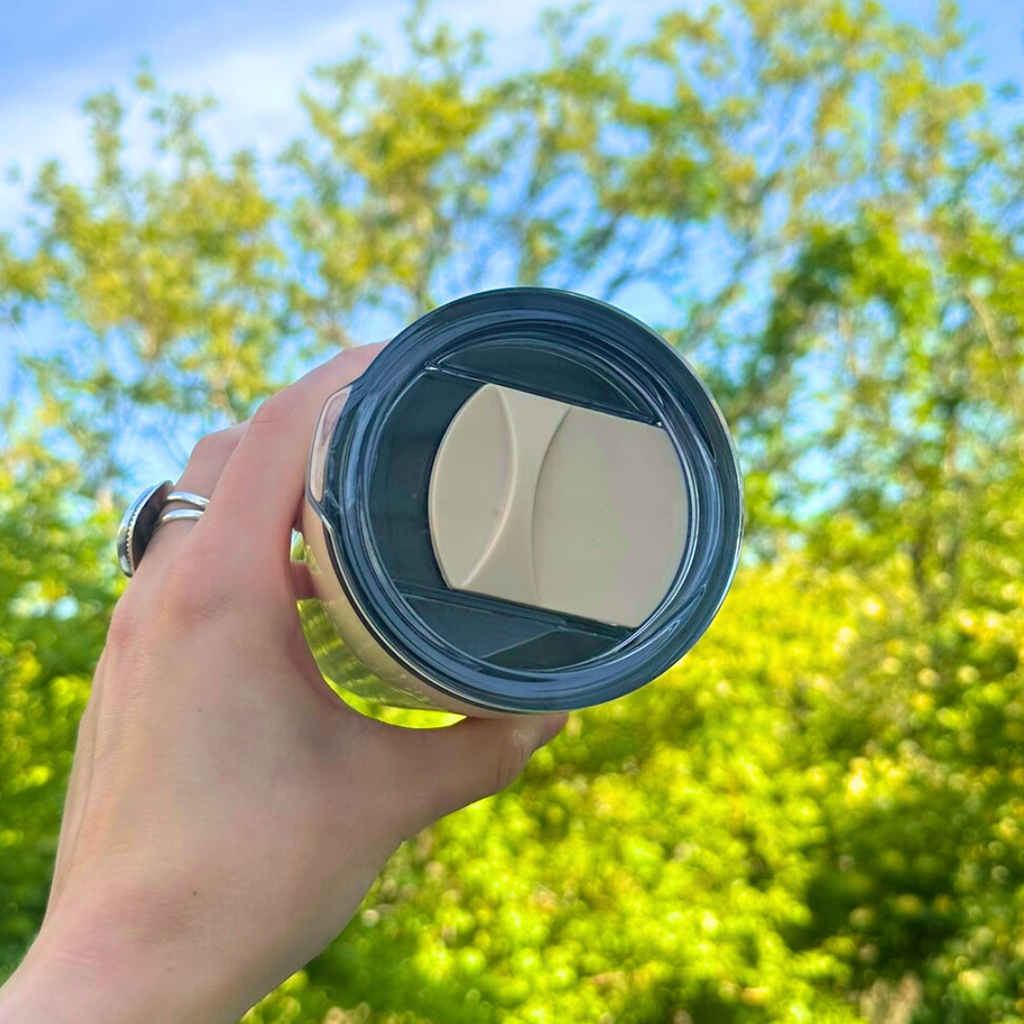 Close-up of slide lid on insulated Old Maine Flag tumbler