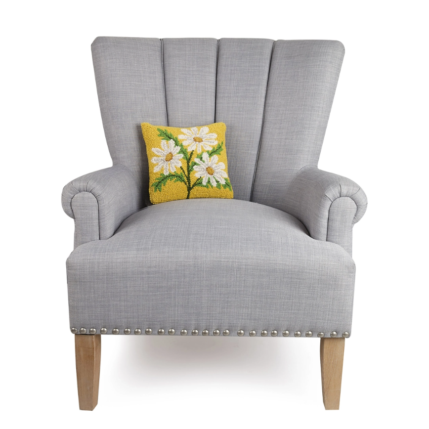 Square wool accent pillow featuring cheerful daisy motif