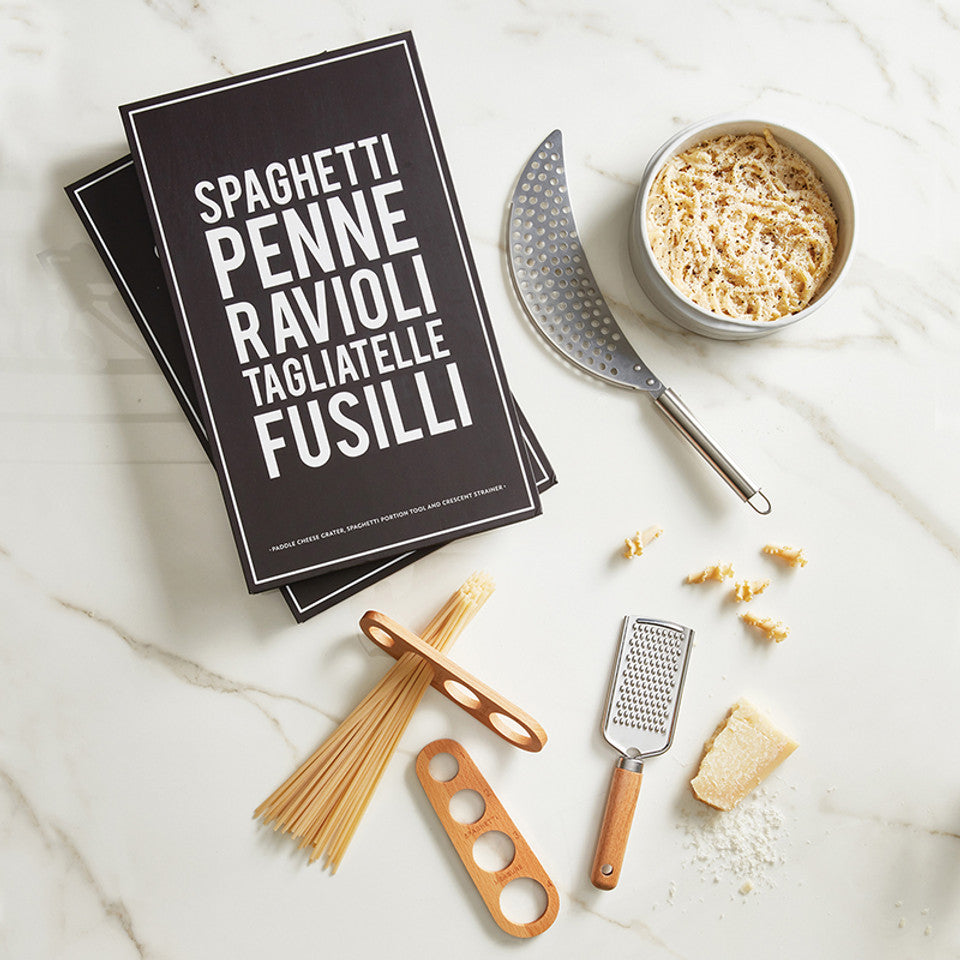 Cheese grater, strainer, and spaghetti measurer in decorative packaging
