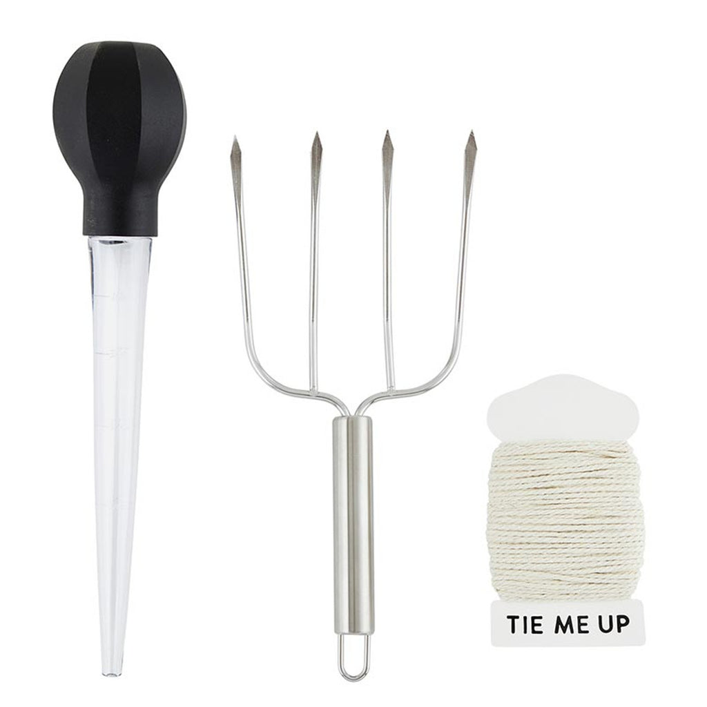 Close-up of stainless steel turkey baster and cotton accessories