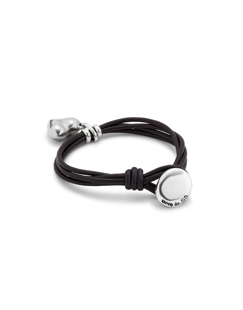Bracelet with 4 leather straps with button closure and sterling silver plated heart charm.