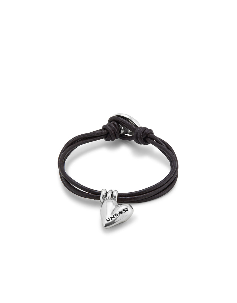 Bracelet with 4 leather straps with button closure and sterling silver plated heart charm.
