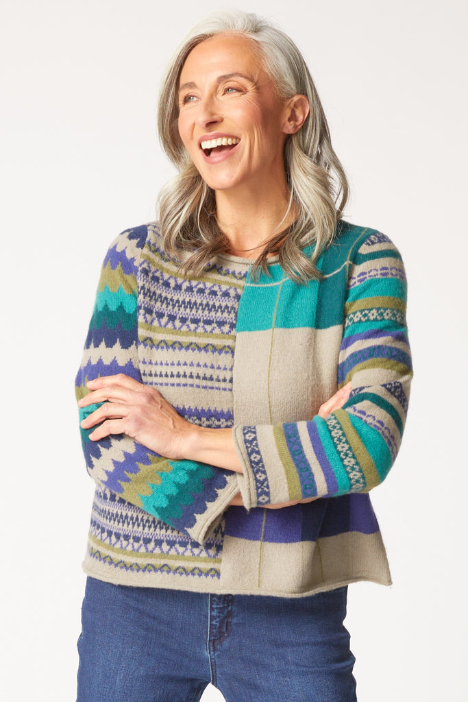 Woman wearing Habitat Winter Whimsy Mixed Pattern Pullover with jeans
