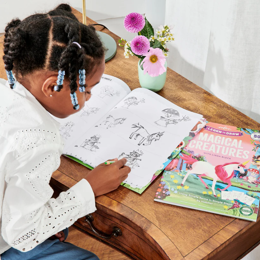 Inside pages showing step-by-step drawing of a unicorn